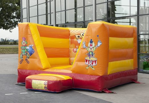 Small open orange bouncy castle for kids with circus theme to buy. Bouncy castles available at JB Inflatables UK online