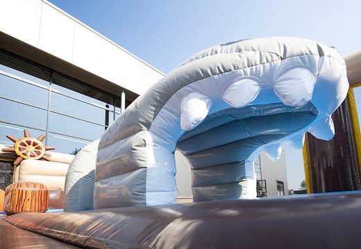 Inflatable bouncer in pirate theme with slides and fun obstacles with prints for children. Buy bouncers online at JB Inflatables UK