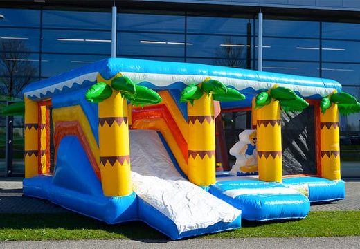 Buy a large Indoor Beach Bouncy Castle with a slide on the jumping surface, climbing tower and fun obstacles inbeach themed with prints for kids. Order bouncy castles online at JB Inflatables UK.