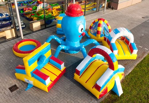 Play island Octopus bouncer with a climbing ramp and crawl tunnel for children to use. Buy bouncers online at JB Inflatables UK