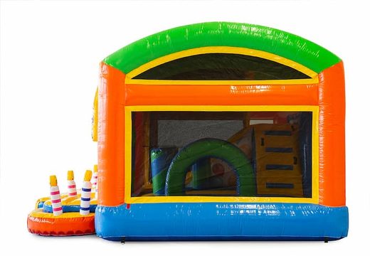 Party themed bouncy castle with a slide and 3D objects for children. Order bouncy castles online at JB Inflatables UK